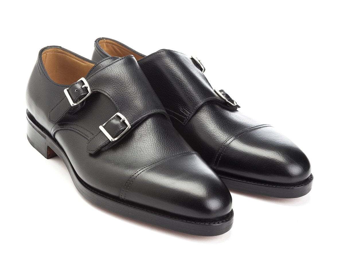 Front angle view of John Lobb William captoe double monk strap shoes in black buffalo calf