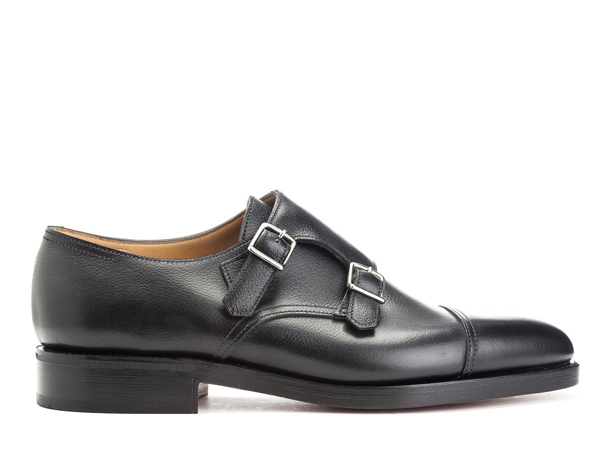 Side view of John Lobb William captoe double monk strap shoes in black buffalo calf