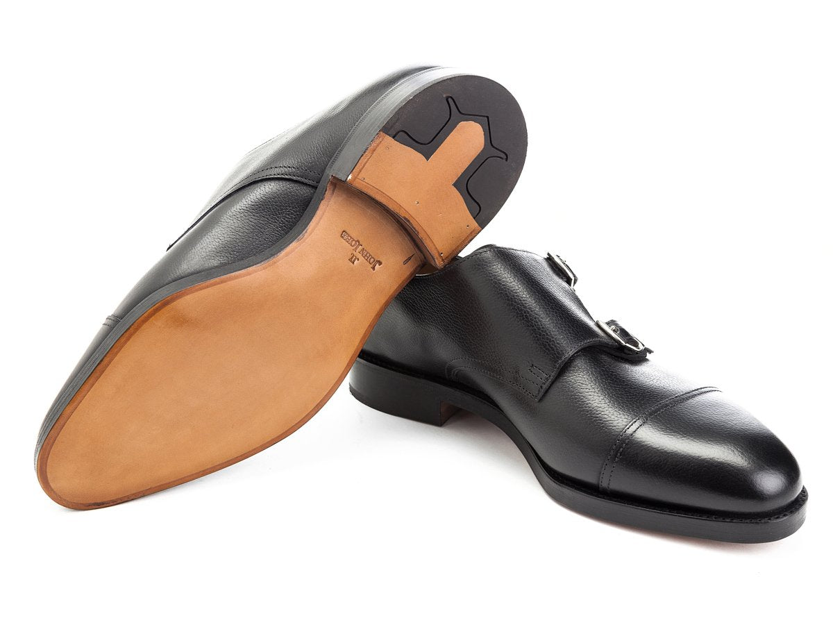 Classic leather sole of John Lobb William captoe double monk strap shoes in black buffalo calf