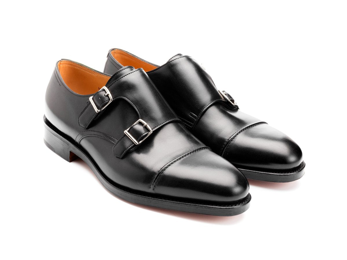 Front angle view of EE width John Lobb William II captoe double monk strap shoes in black calf