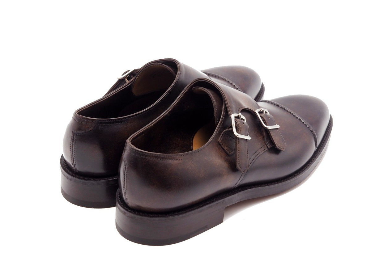 Back angle view of John Lobb William II captoe double monk strap shoes in dark brown museum calf