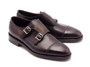 Front angle view of John Lobb William II captoe double monk strap shoes in dark brown museum calf