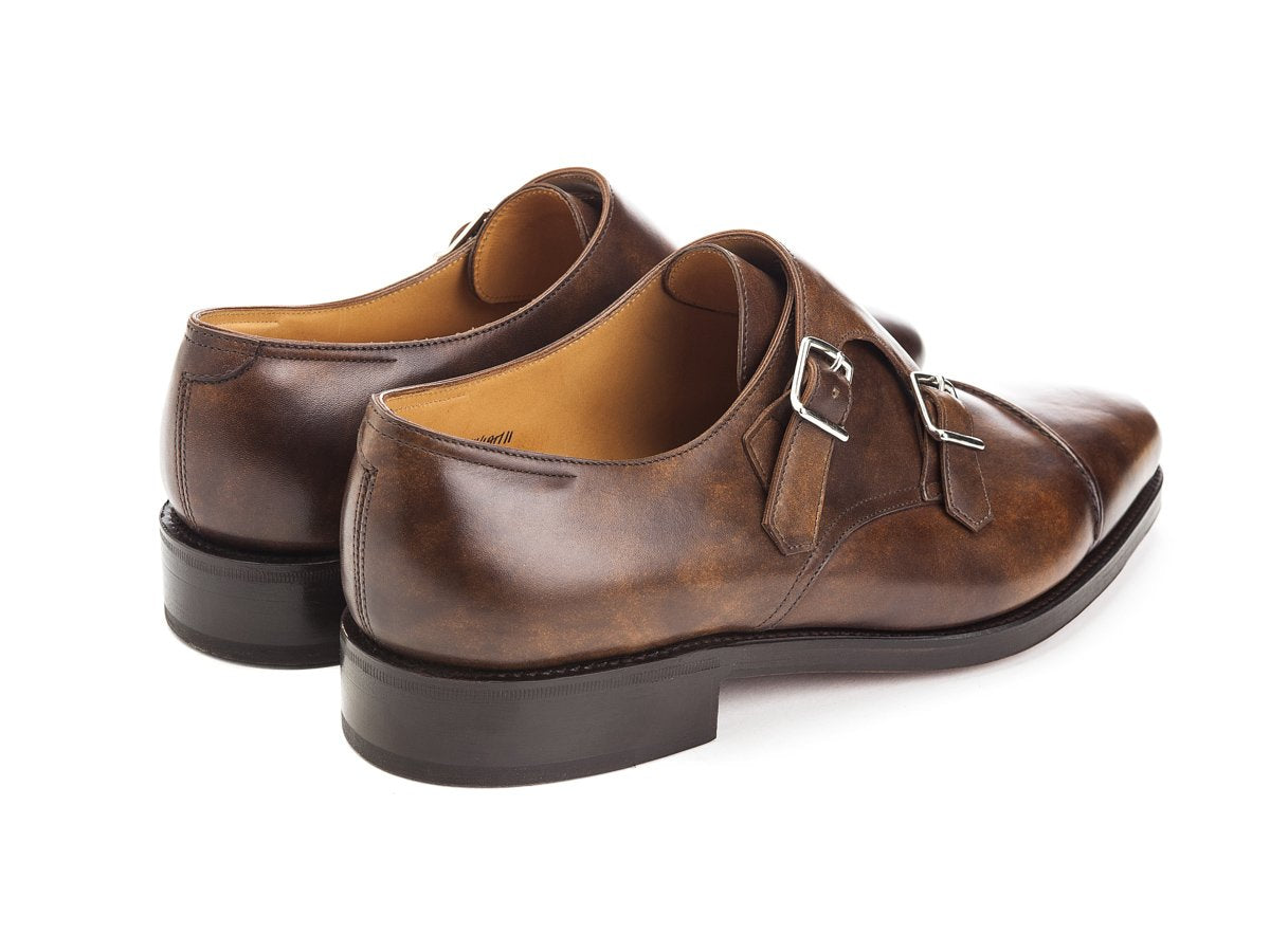 Back angle view of John Lobb William II captoe double monk strap shoes in parisian brown museum calf
